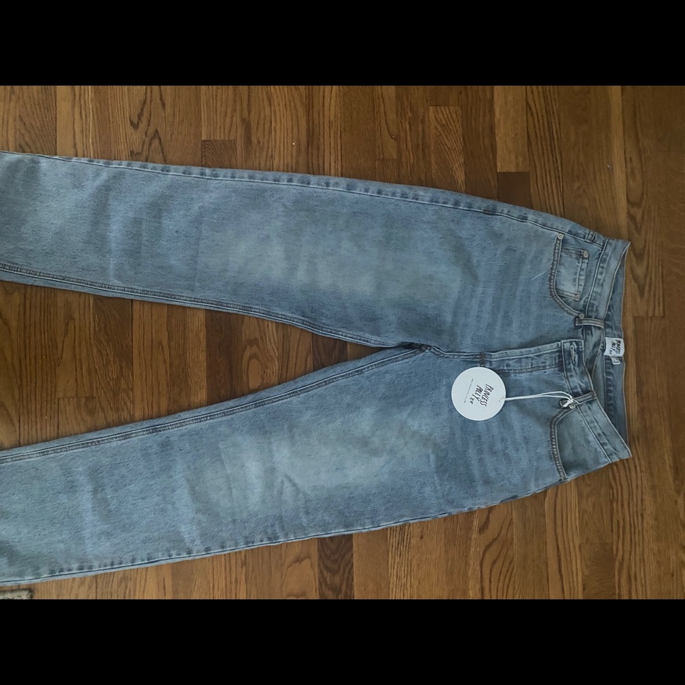 Princess Polly asymmetrical light wash jean